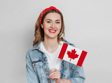 young-girl-student-smiling-holding-small-canada-flag-isolated-grey-wall-canada-day-holiday-confederation-anniversary-copy-space_101969-1502